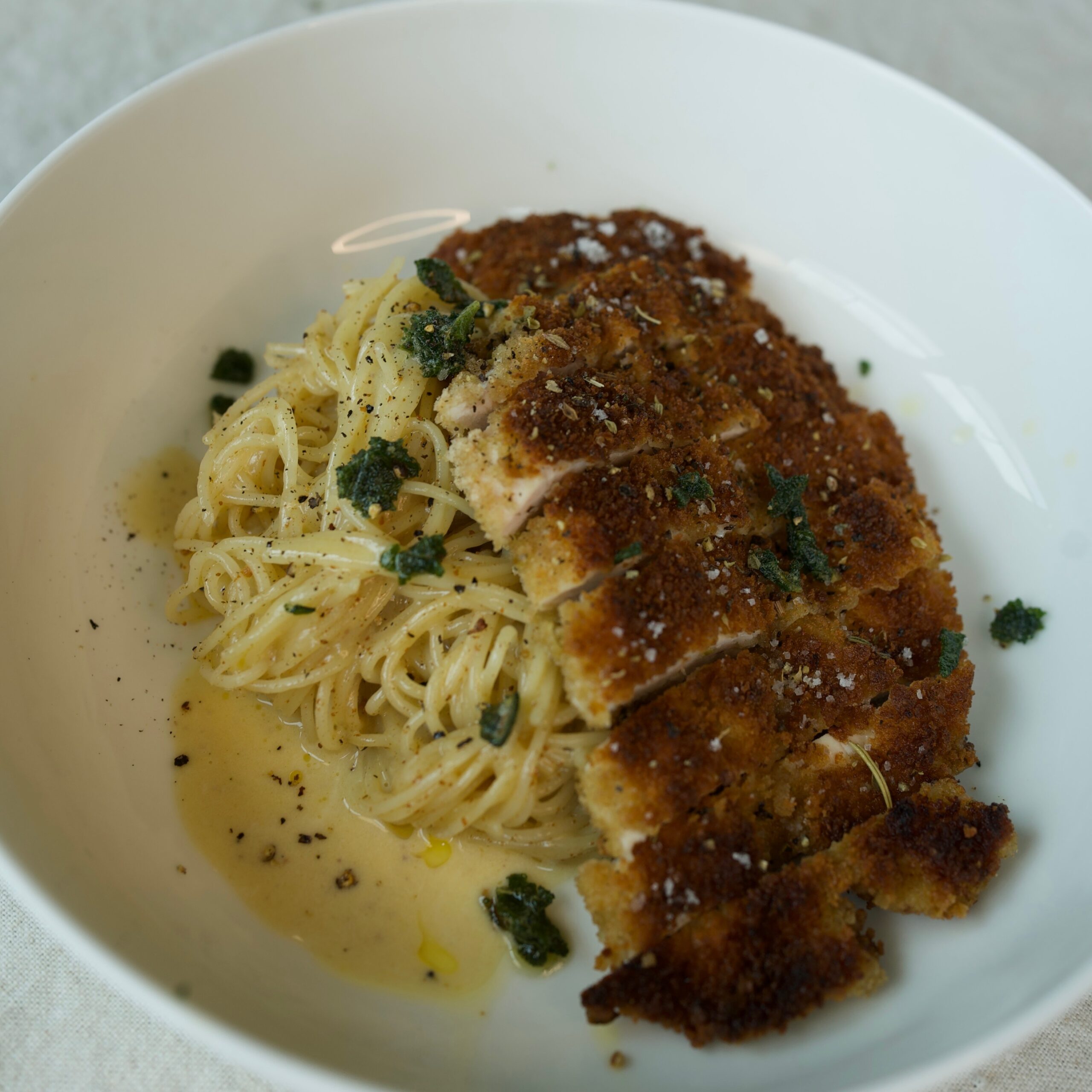 yellow pasta chicken cutlet white bowl basil fried sage