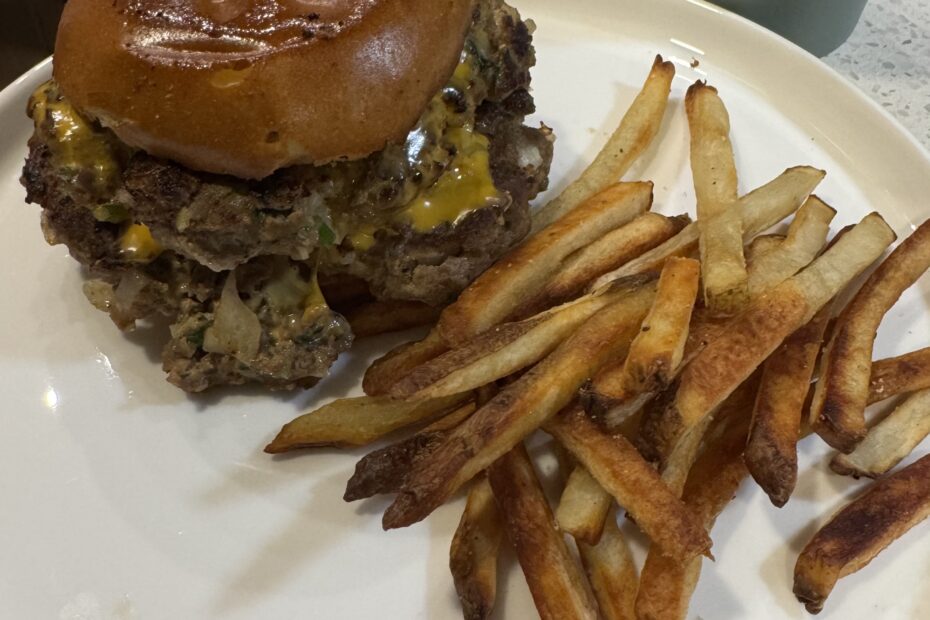Juicy grass-fed mushroom swiss smash burger with melty Swiss cheese, sautéed shiitake and baby bella mushrooms, on toasted bun with garlic aioli